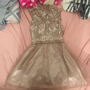 A cute homecoming, winter ball dress. Knee length